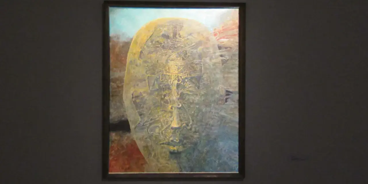 Jedna z najsłynniejszych obrazów Beksińskiego: surrealistyczna, złocista twarz wyłaniająca się z mroku, pełna tajemniczych detali.
