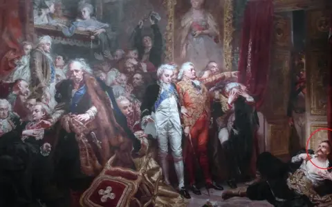 Tadeusz z obrazu Matejki, leżący na ziemi, z uniesioną głową i ręką na piersi, w otoczeniu innych postaci.