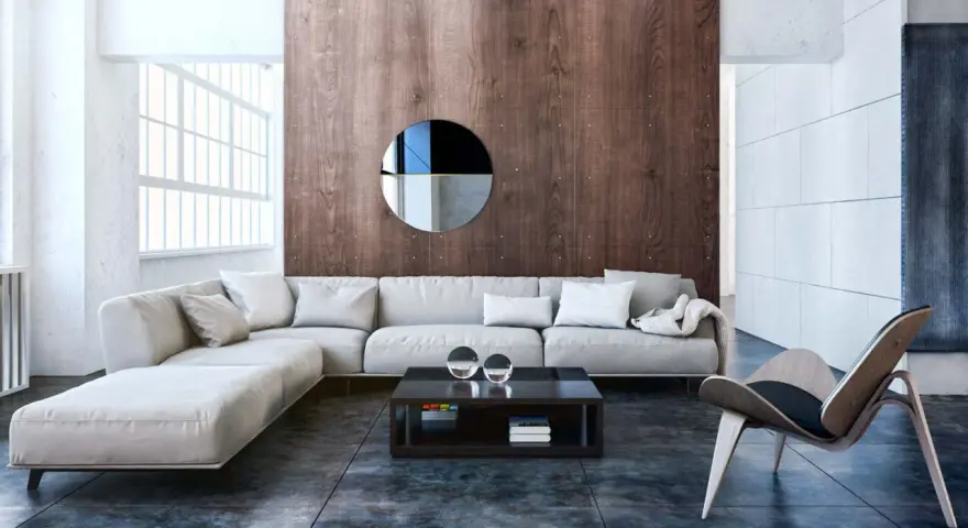 Nowoczesny salon w stylu bauhaus z szarą sofą, drewnianą ścianą i designerskim fotelem.