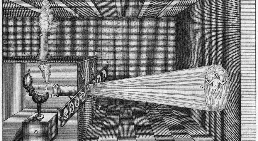 Eksperyment z camera obscura: światło z płomienia przechodzi przez soczewki, tworząc obraz postaci w płomieniach.